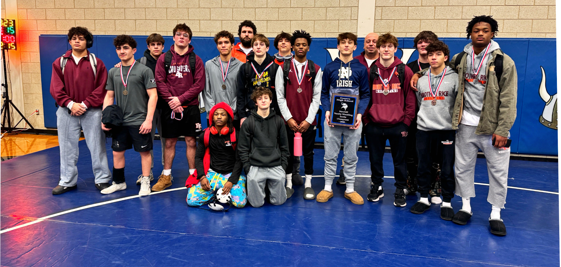 Brother Rice wrestling team with the invite championship plaque